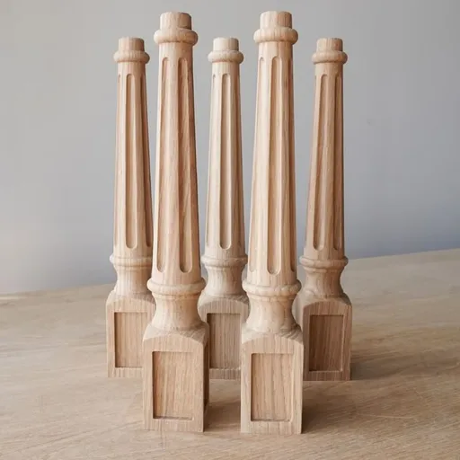 Tapered table legs fluted with carved squares from oak